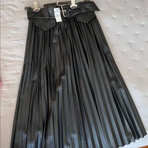 Beautiful pleaded black faux leather skirt, brand new.